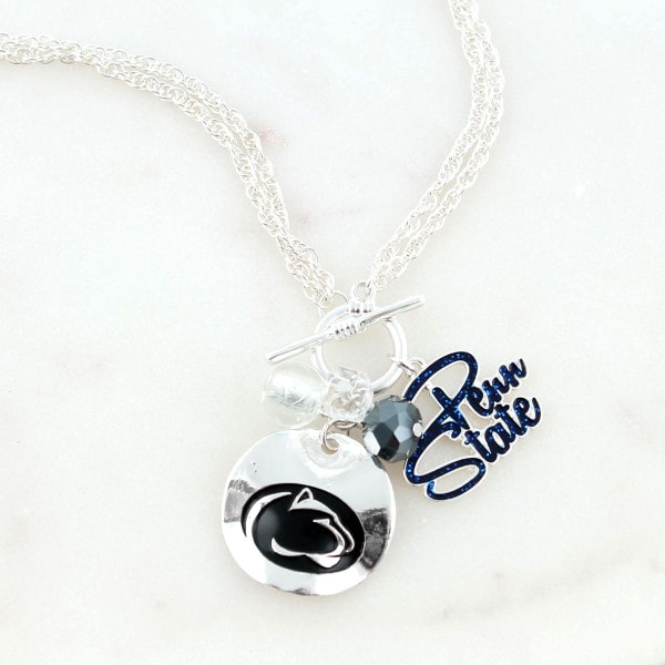 close up of necklace with Penn State charm, beads, and Athletic Logo
